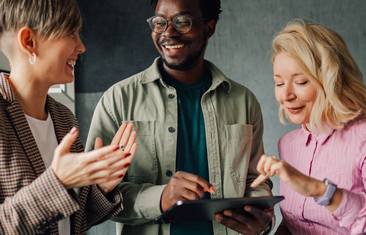 Group of people using iPad