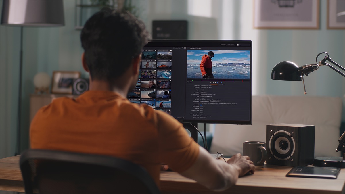 Man using a content management system to sort through his media