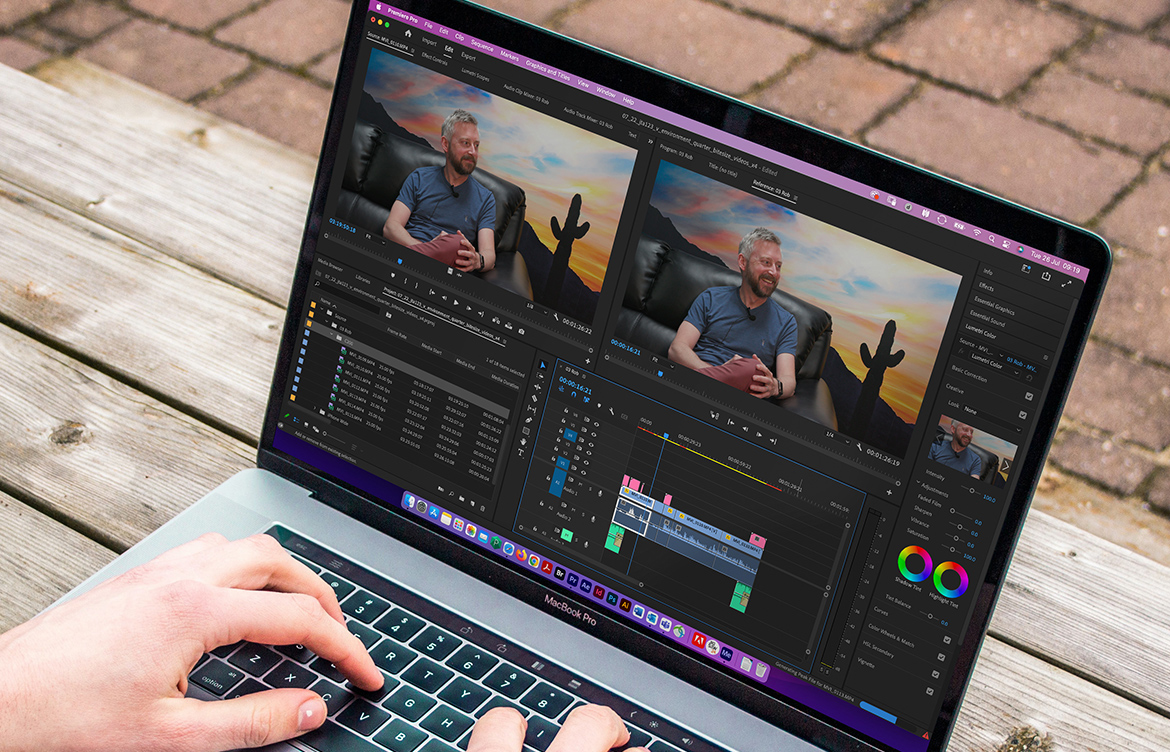 Person working with Adobe Premiere Pro on a MacBook