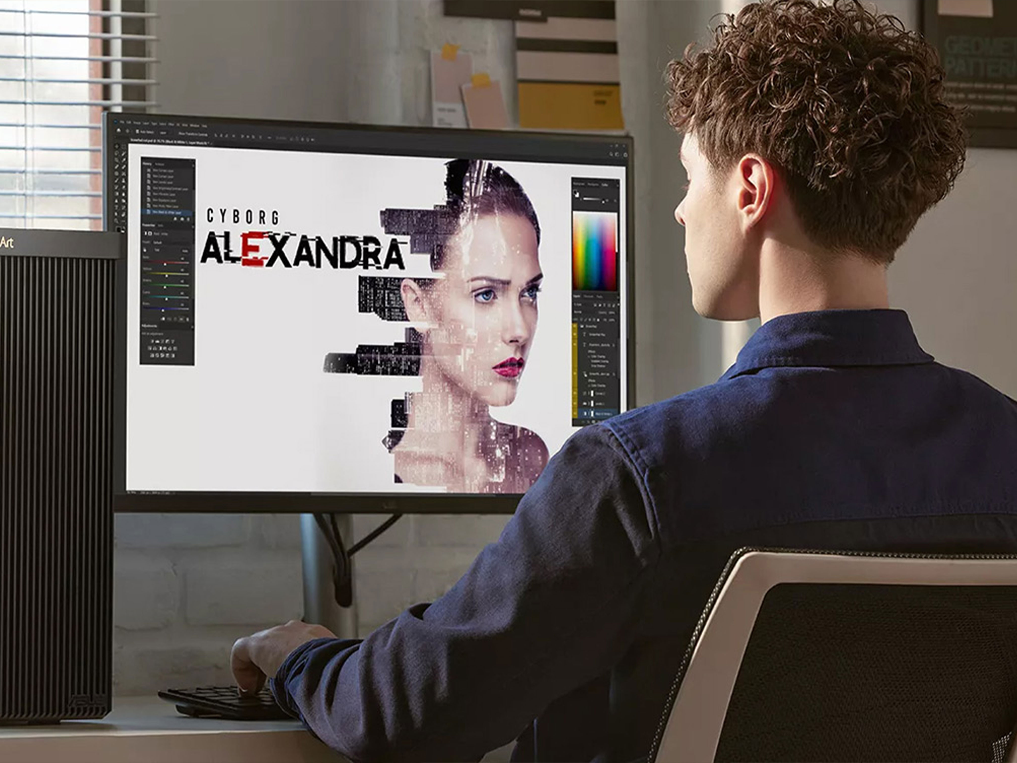 Person sat at a desk with an ASUS screen