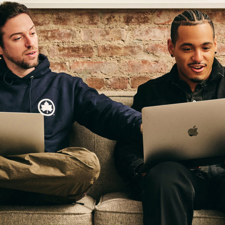 Two men using LucidLink on their MacBook Pro devices