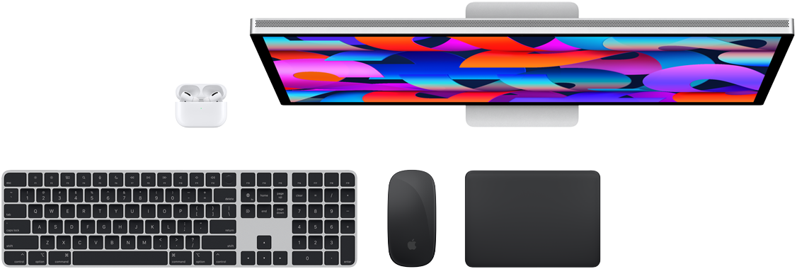 Top view of AirPods, Studio Display, Magic Keyboard, Magic Mouse and Magic Trackpad
