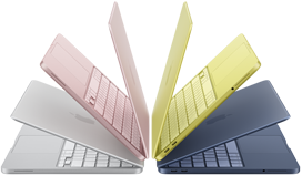 MacBook Neo laptops in silver, blush, citrus and indigo colours, slightly open and arranged in an arch formation
